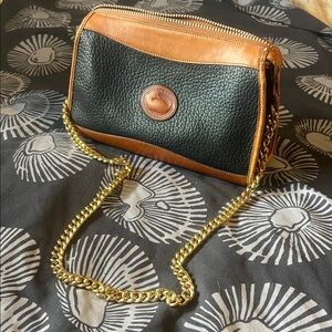 Dooney and Burke Elegant Black and Tan Leather Chain Bag